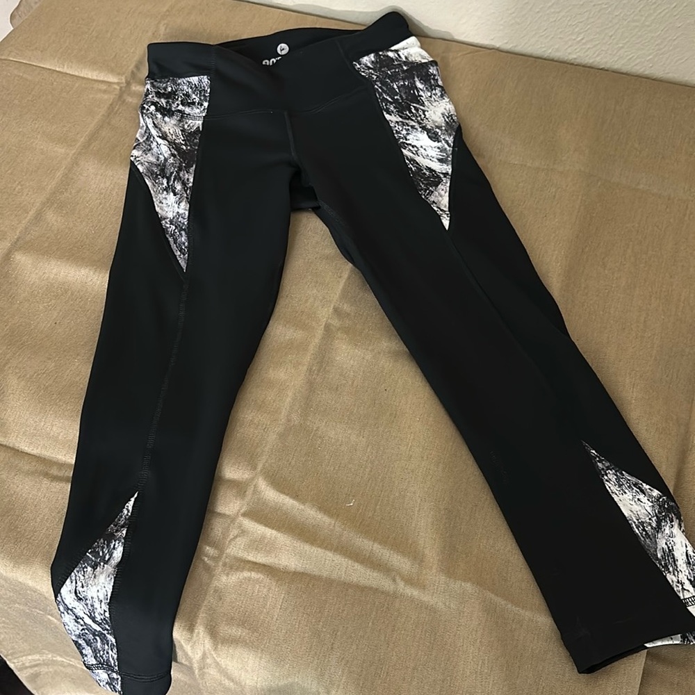 90 degree by reflex knee length workout leggings.